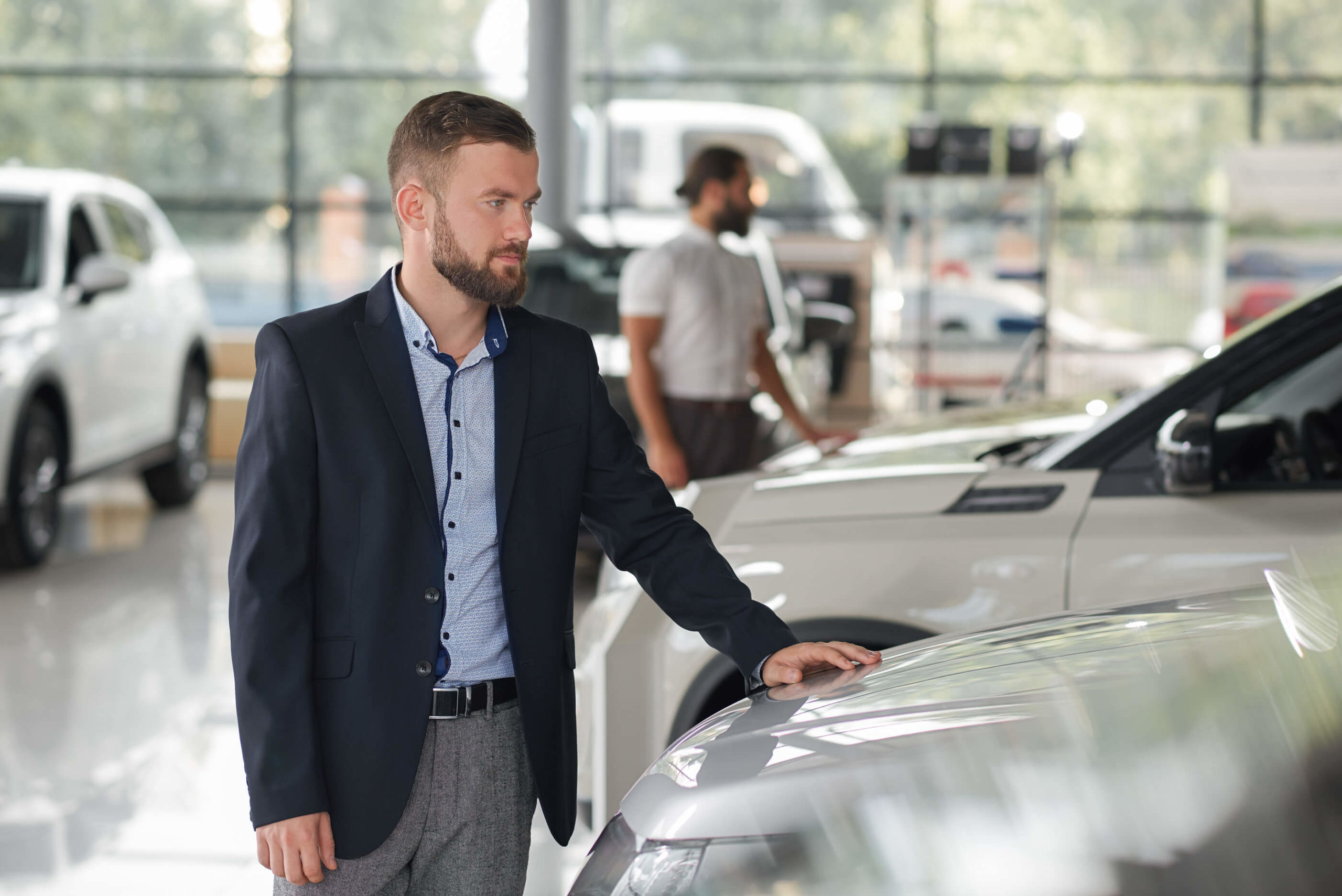 Men-Looking-For-Vehicles-To-Buy-In-Car-Dealership