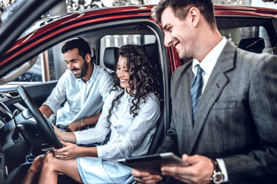 Young-Couple-sitting-in-new-car