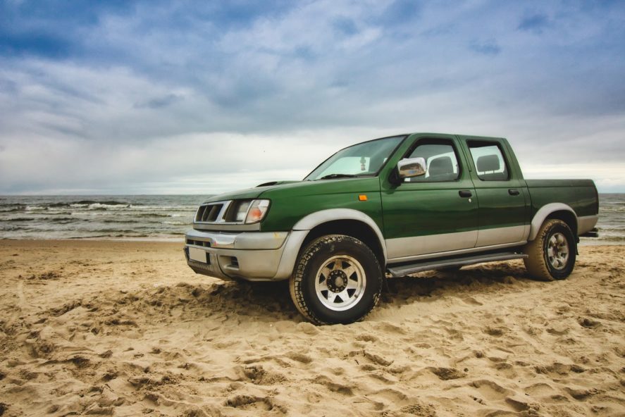 Used-truck-green-on-the-beach