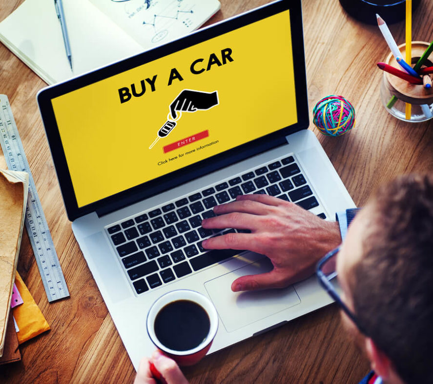 Man-buying Used-Car-online-via-laptop